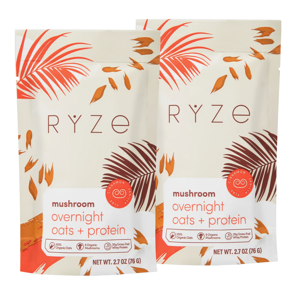 Two packages of RYZE mushroom overnight oats and protein on a white background