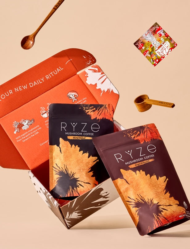RYZE mushroom coffee packages with an open box on a beige background