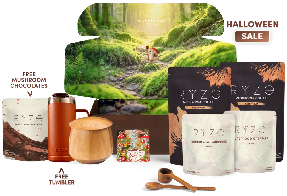 A curated gift set featuring a large forest-themed box, two bags of RYZE mushroom coffee, two RYZE superfood creamer pouches, a free tumbler, and a free mushroom chocolate gift bag, arranged on a white background with 'HALLOWEEN SALE' text.