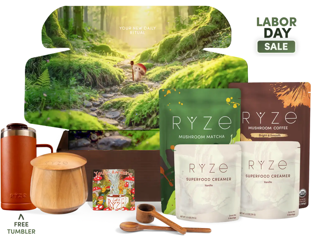 A Labor Day gift set from RYZE featuring a forest-themed box, mushroom matcha, mushroom coffee, two flavors of superfood creamer, a free tumbler, and wooden measuring tools, with a 'Labor Day Sale' badge.